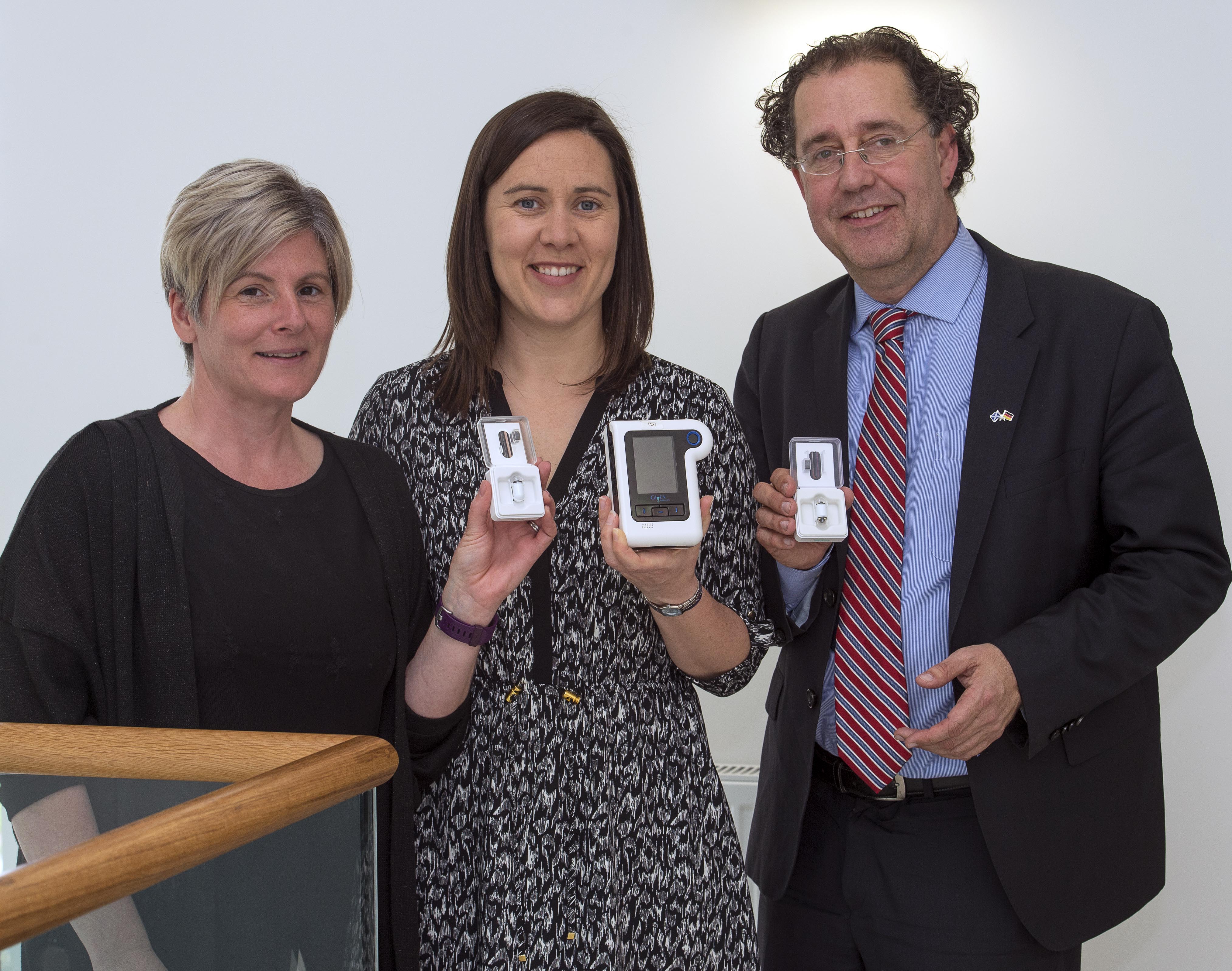 Lesley Patience and Dr Cornelius Glismann from CorporateHealth international with Anna Miller of HIE holding colon capsule camera